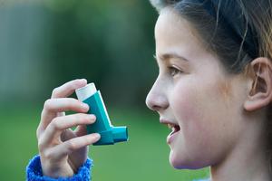 a girl with an inhaler