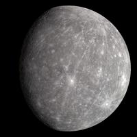 A photo of the planet Mercury from space. It is gray and has many craters.