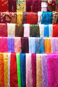 Multiple differently colored silk scarves