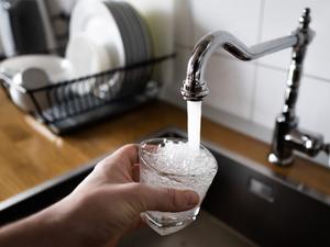 a color photo of water pouring in a sink