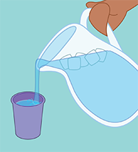 Someone fills a glass with liquid.